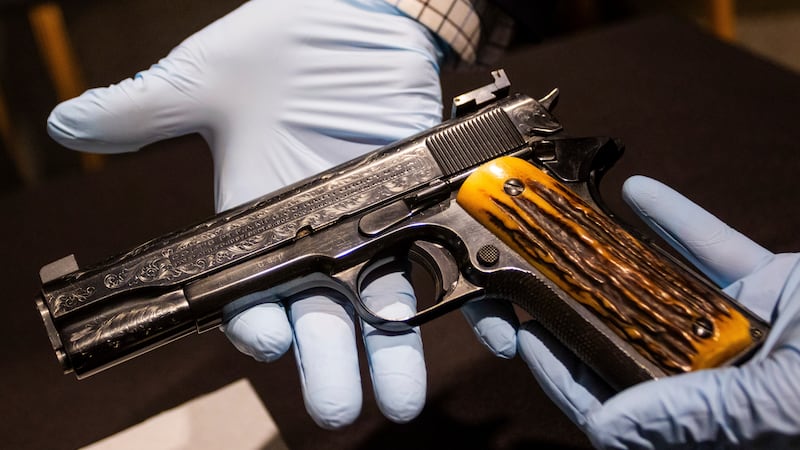 This photo taken Monday, Dec. 23, 2024, in Las Vegas shows a Colt .45-caliber pistol that once...