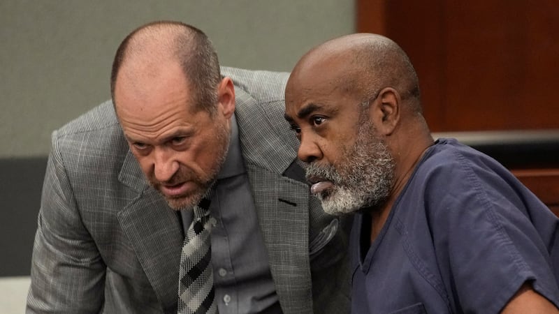 Duane "Keffe D" Davis, right, speaks with attorney Ross Goodman in court Thursday, Oct. 19,...