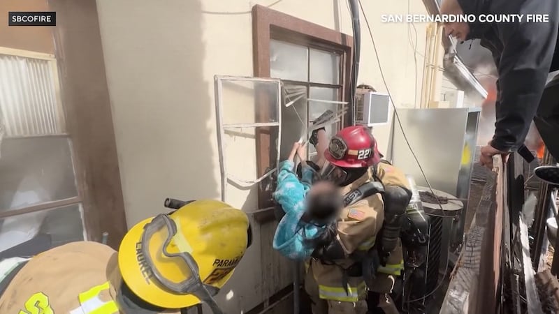 Firefighters saved a 23-year-old woman with cerebral palsy trapped inside her burning home....