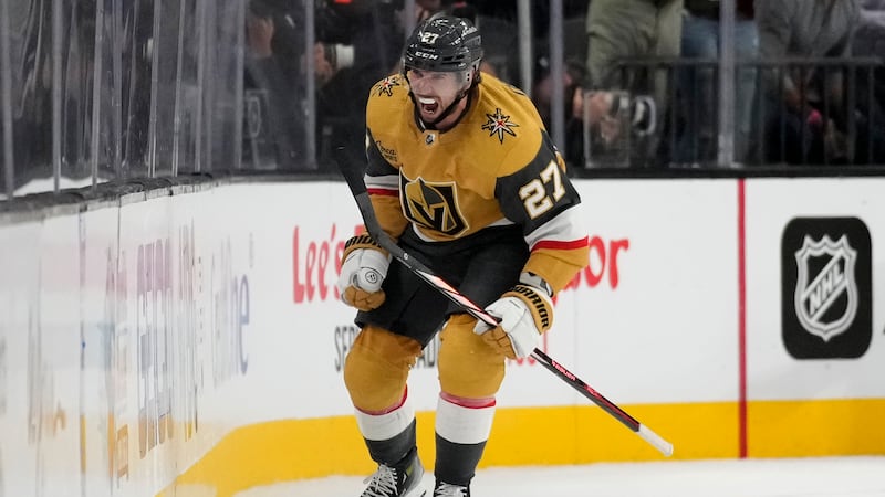 Vegas Golden Knights defenseman Shea Theodore (27) celebrates after scoring against the...