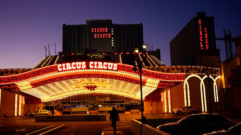 In this Feb. 4, 2021, file photo, a man walks in front of the Circus Circus hotel and casino...