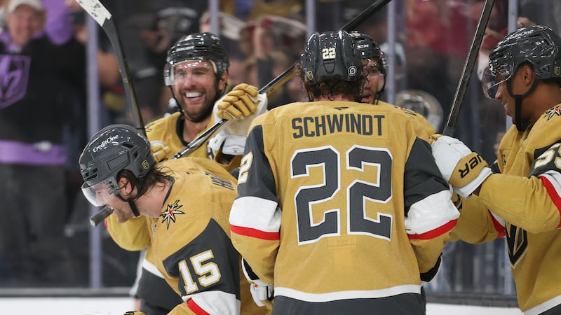 Vegas Golden Knights defenseman Noah Hanifin (15) celebrates with teammates after scoring a...