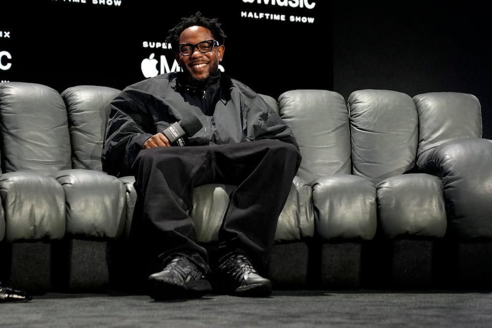 Apple Music Super Bowl LIX Halftime Show performer Kendrick Lamar smiles during a news...