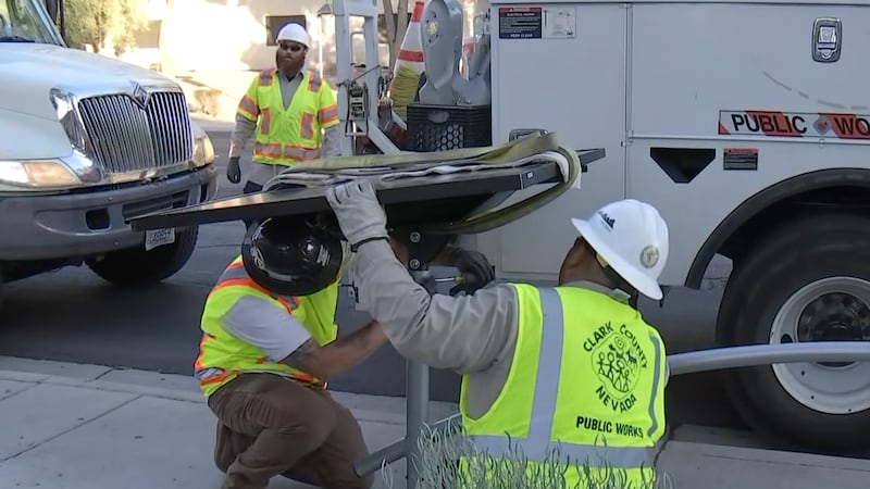 Las Vegas workers install solar streetlights in the east valley on Thursday, Aug. 22, 2024.