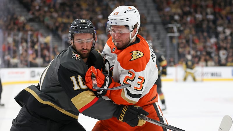 Vegas Golden Knights center Nicolas Roy (10) and Anaheim Ducks center Mason McTavish (23)...