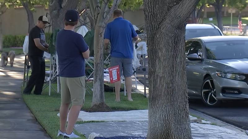 Community members stake out spots to watch the Summerlin Patriotic Parade on Wednesday, July...