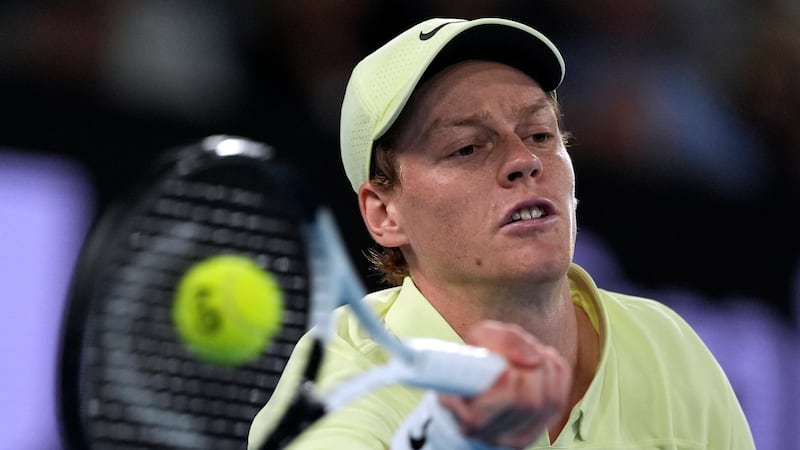 Jannik Sinner of Italy plays a forehand return to Alex de Minaur of Australia during their...