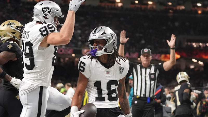 Las Vegas Raiders wide receiver Jakobi Meyers (16) celebrates with teammate tight end Brock...